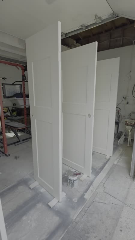 White paneled doors during spray painting by Coolrunnings